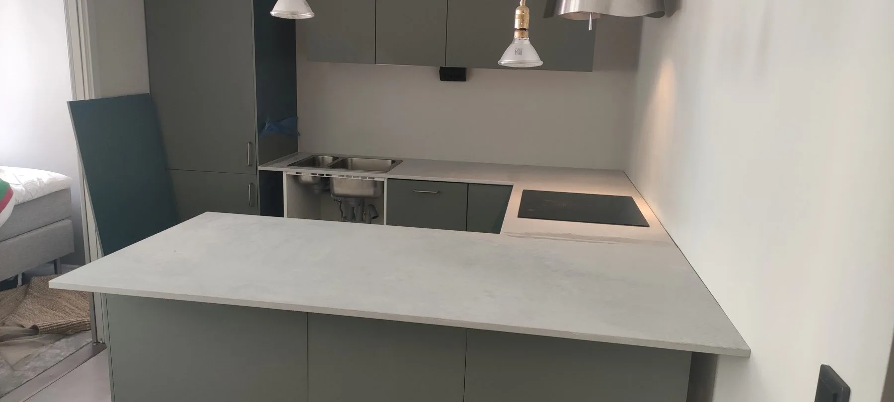 Caesarstone Airy Concrete quartz kitchen island, installed by Stoneks