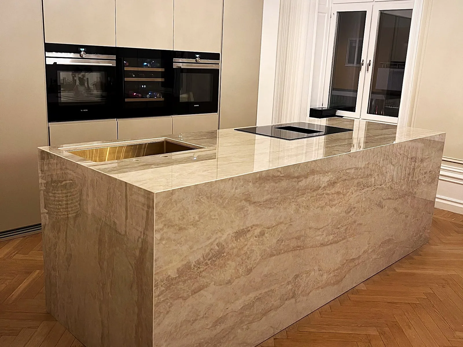 Dekton Arga kitchen island with stone side panels, installed by Stoneks