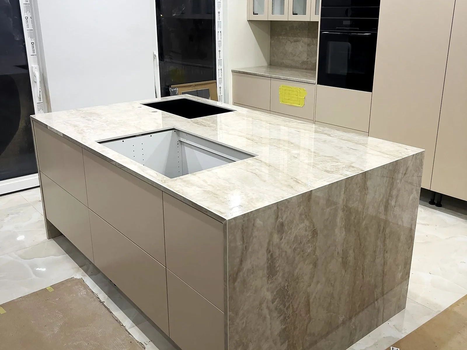 Nuovo Corso Makrana ceramic kitchen island with stone side panels, installed by Stoneks