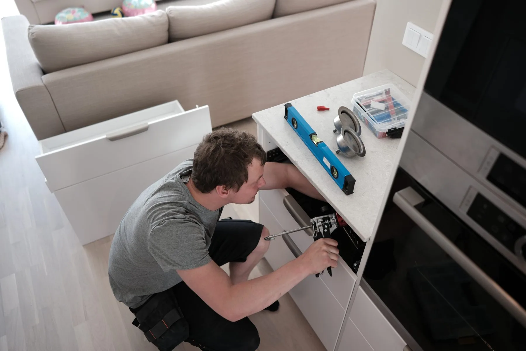 Stoneks installer fixing a kitchen worktop in place